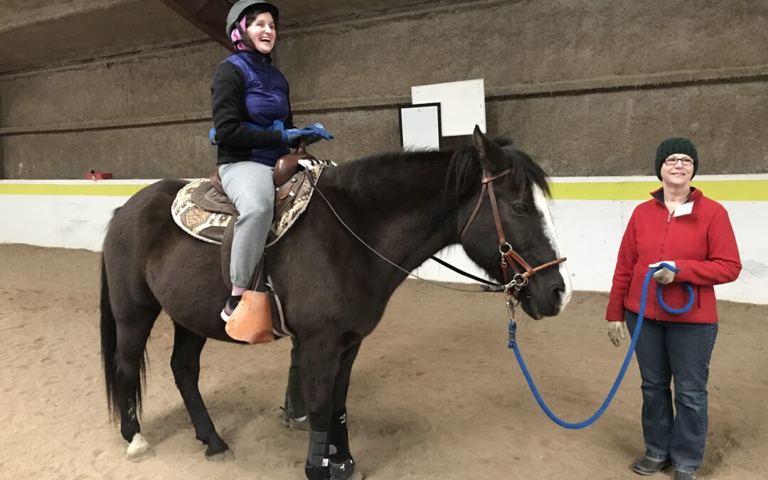 Hannah laughs with her volunteer team during her session.